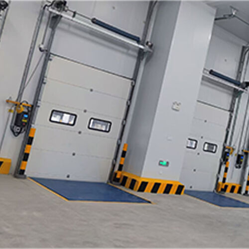 Insulated 24dB Industrial Sectional Overhead Door For Multi-Tenant Industrial Buildings