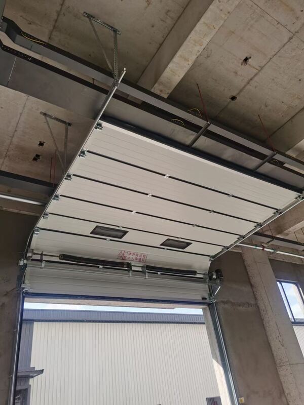 Emergency Manual Operation Industrial Sectional Overhead Door with Wind Resistance Level 7-8 and 24dB Sound Insulation
