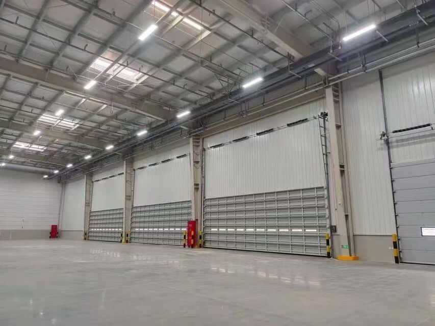 Flexible Lift Configuration Industrial Sectional Overhead Door for High-Ceiling Warehouses with Wind Resistance Level 7-8